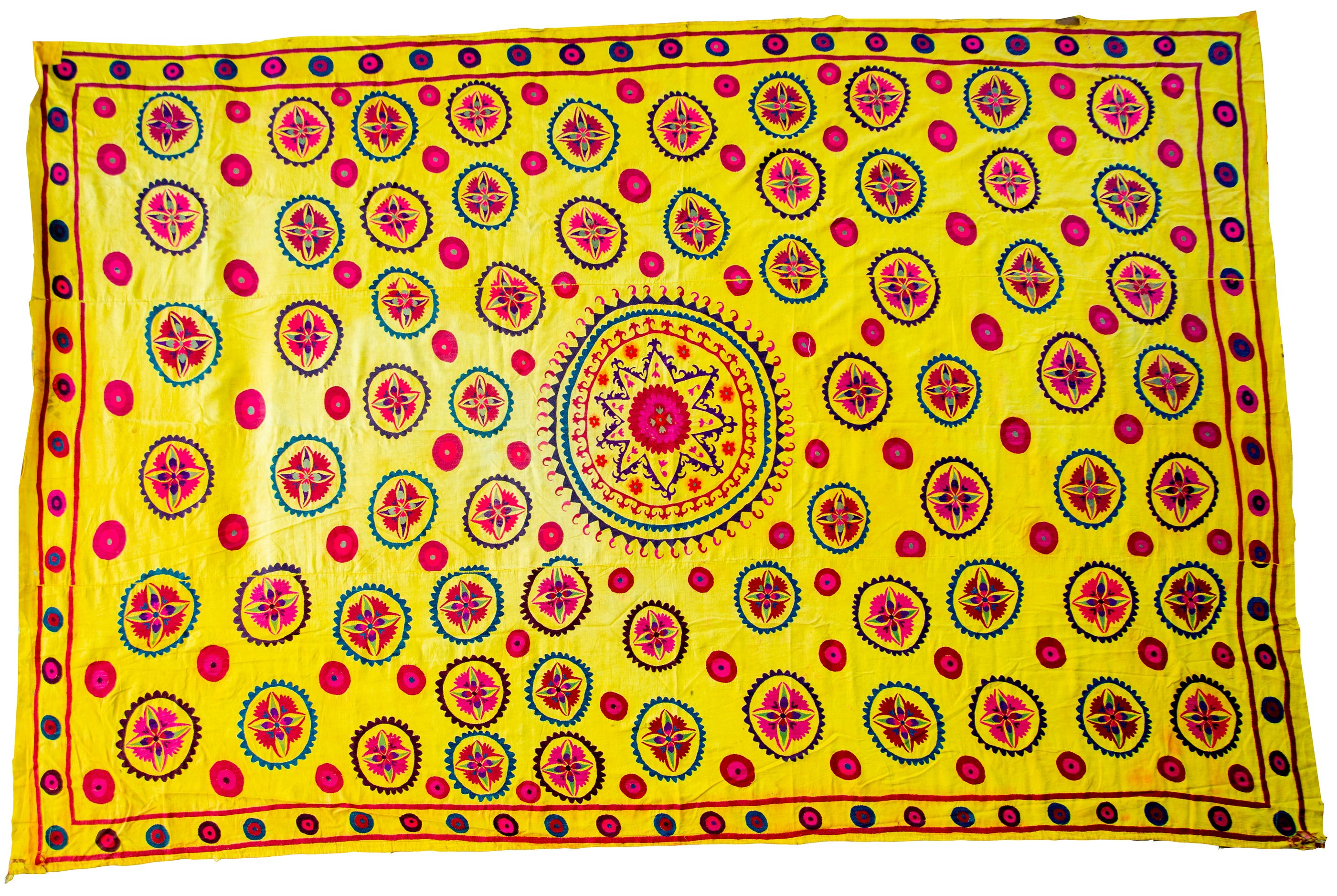 Saffron ground, scattered rosettes — suzani, Dushanbe
